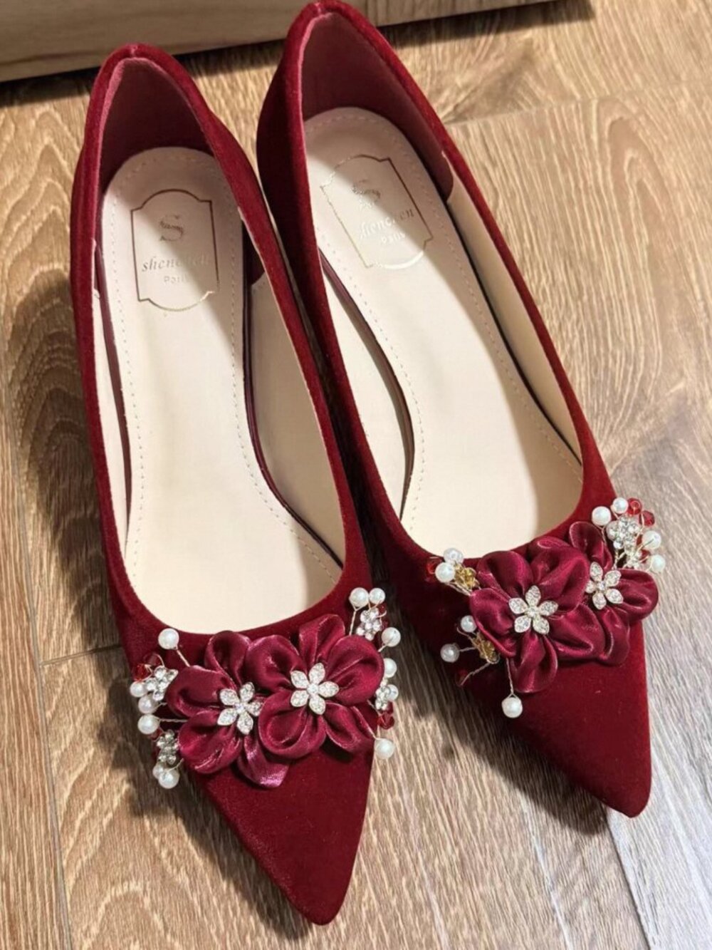 Red suede pointed-toe stiletto heels with beaded flower detail, wide fit, comfor